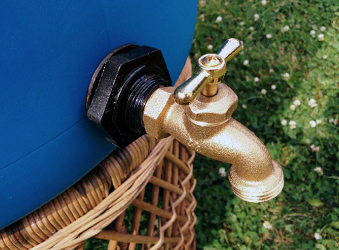 Bottom spigot on a classic rain barrel.