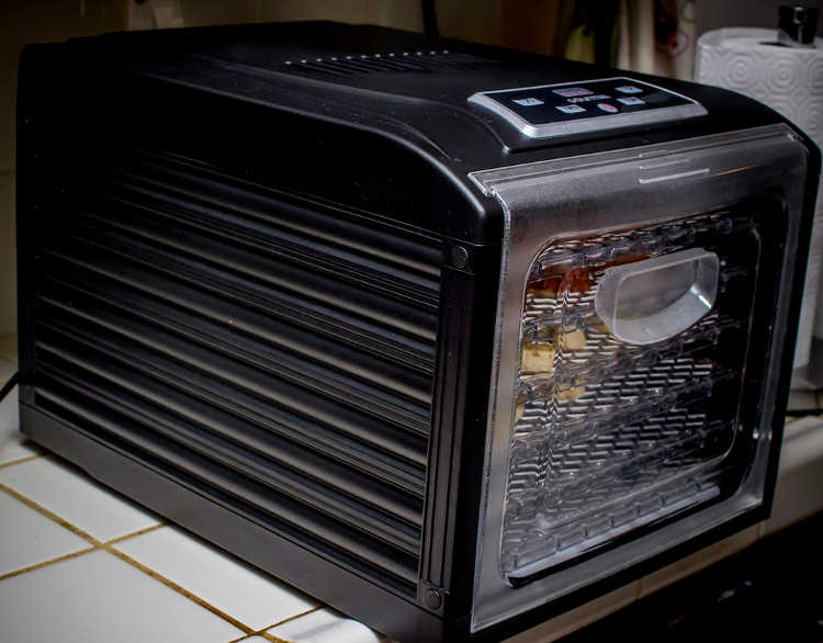 Sliding tray dehydrator