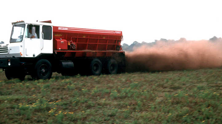 Spreading composted chicken manure